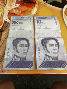 two Bolivares bills, the local Venezuelan currency